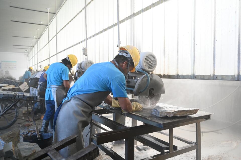 A wide view of a cutting workshop showcasing advanced equipment used in paper manufacturing