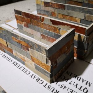 A weathered gray corner showcasing rustic design elements.