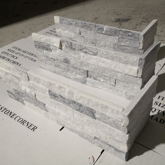 Corner piece of silver gray stacked stone for wall cladding