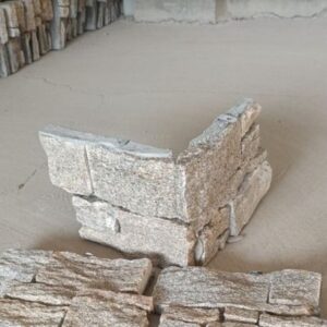 Corner piece for stone cladding showcasing textured surface