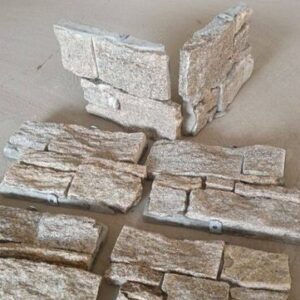 Close-up of corner stone cladding panels in warm tones