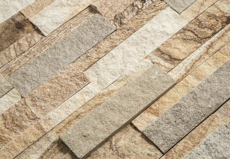 Contemporary stacked stone wall featuring various textures and colors