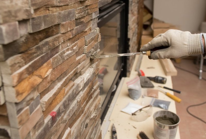 Chipped and cracked stacked stone veneer ready for repair