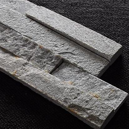 A close-up view of a Split Face Mini Ledger Stone Panel showcasing its textured surface and unique colors.